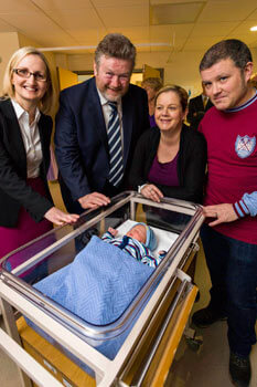 Dr. Sharon Sheehan, Master of the Coombe, Health Minister, Dr. James Reilly pictured with Pamela and Billy Mooney and their newborn baby Finn at the opening of the new Coombe unit.